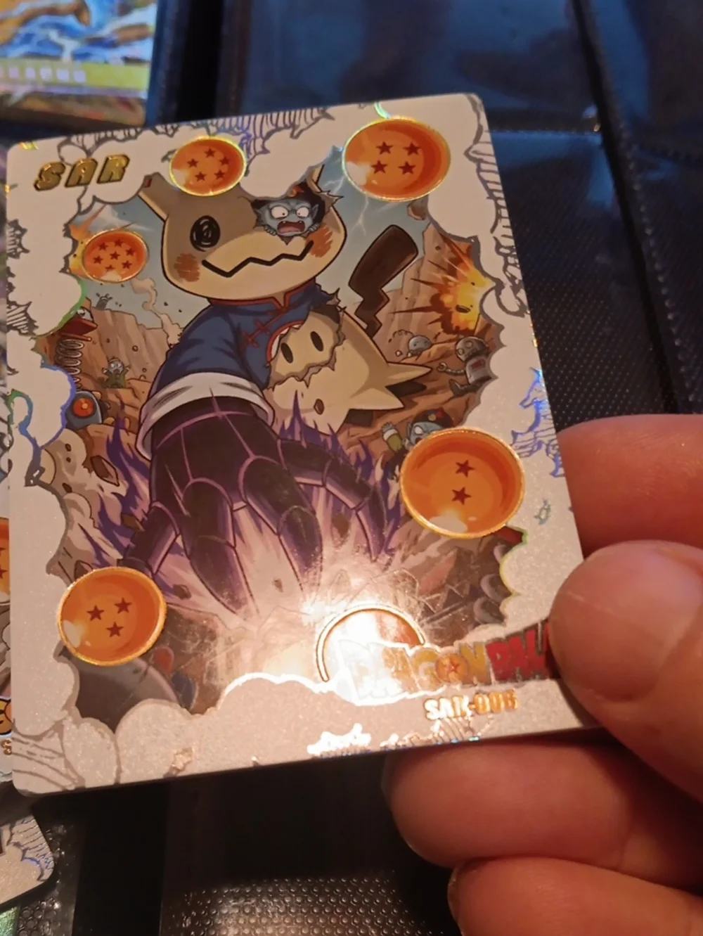 Pokemon Mimikyu Holographic Card - Silver with Orange Orbs